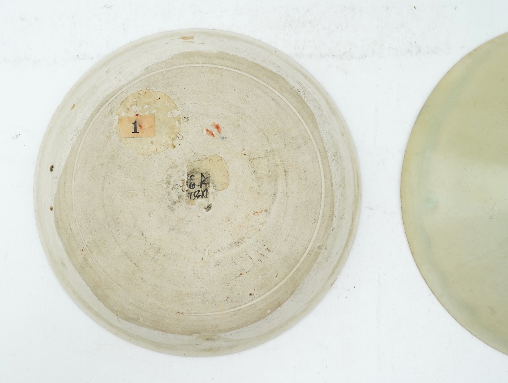 A Chinese Ding type circular dish, Song dynasty and a qingbai moulded conical bowl, Song-Yuan dynasty